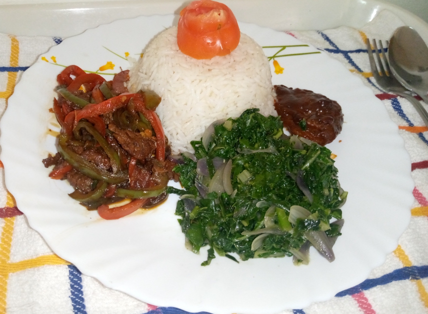 Beef with rice and greens prepared for a gathering by Ravine Bistro Kitchen